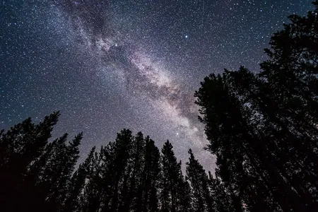 The Milky Way lights up a night sky accented by the bright stars of the &ldquo;summer triangle.&rdquo;