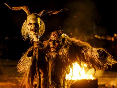 A man dressed in a traditional Perchten costume and mask performs during a Perchten festival in the western Austrian village of Kappl, November 13, 2015. Each year in November and January, people in the western Austria regions dress up in Perchten (also known in some regions as Krampus or Tuifl) costumes and parade through the streets to perform a 1,500 year-old pagan ritual to disperse the ghosts of winter.
