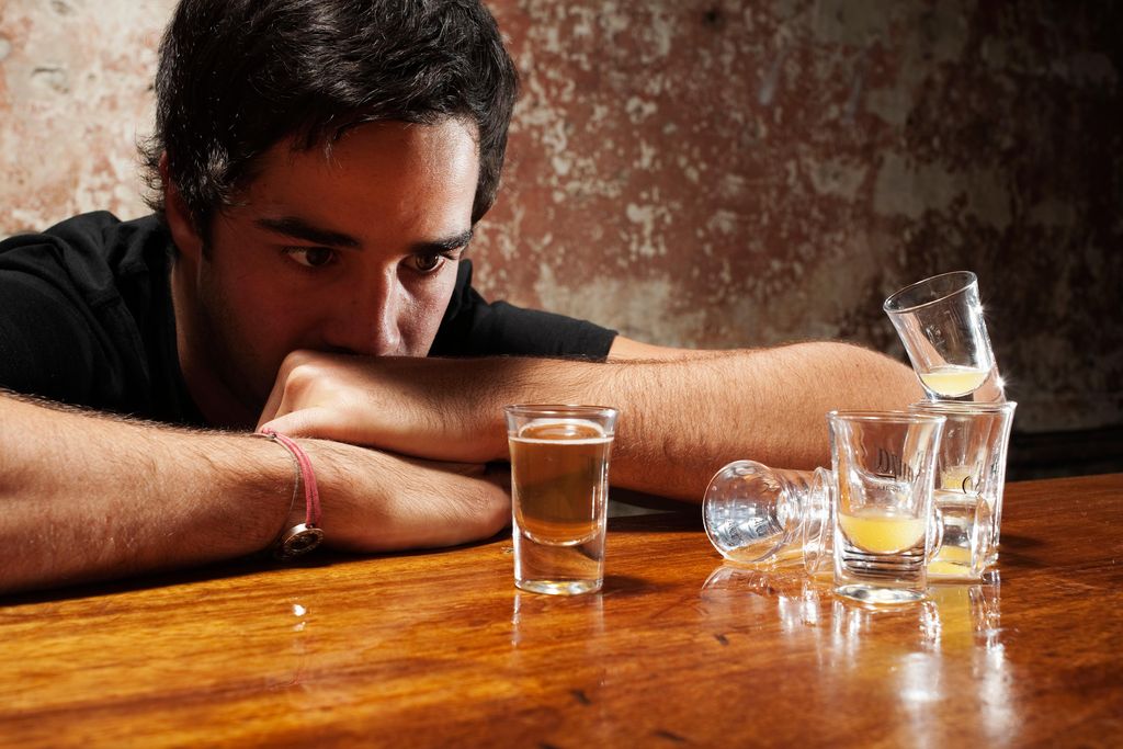 man drinking shots