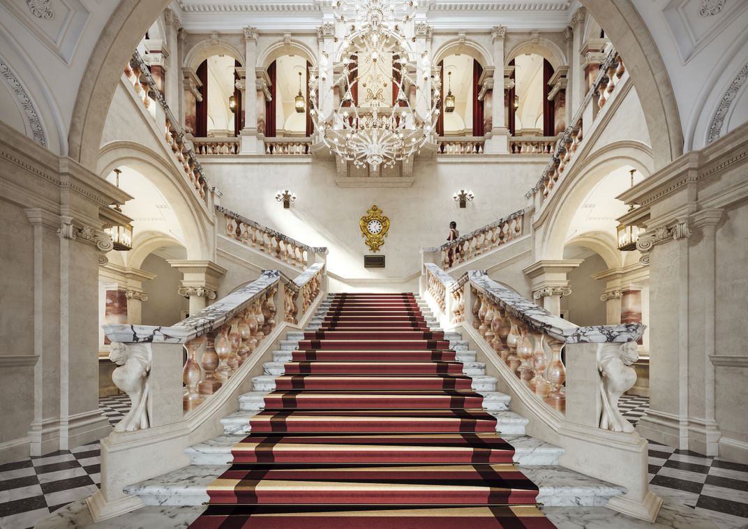 Marble staircase with red carpet