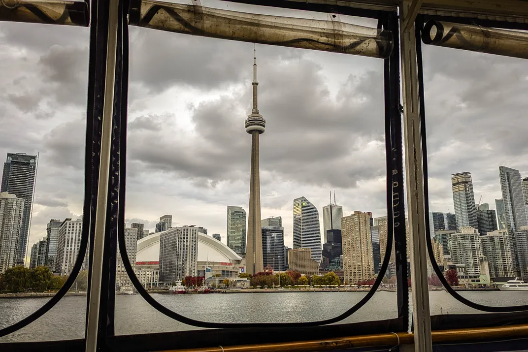 13 - Beneath ominous clouds, the iconic CN Tower is seen from a harbor cruise.