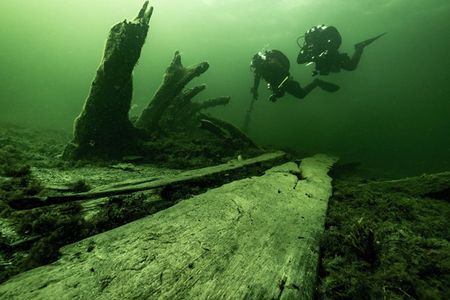 Researchers Johan R&ouml;nnby and Rolf Warming examine the stern of the ship that sunk over 500 years ago off the coast of Sweden.