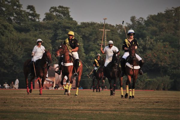 A polo team walking together during an intermission in the match thumbnail