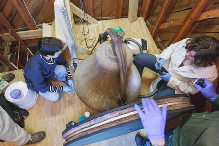 Conservationists assess the bell, which was not rung throughout much of the 20th century after it fell into disrepair.