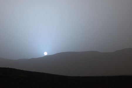 The Sun is seen setting through the Martian atmosphere by the Curiosity rover. Nighttime can bring turbulent snowstorms in the planet's atmosphere