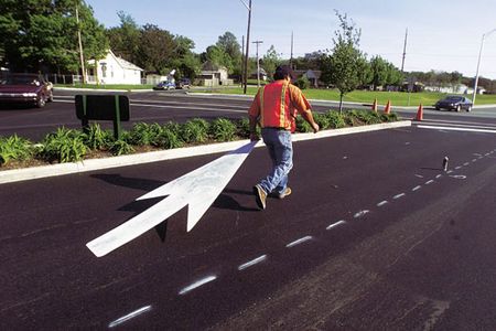 Lafayette, IndianaIf Americans know where they're going, some thanks are due road workers like Tony Ybarra, preparing to stencil fresh blacktop and to set some drivers straight.