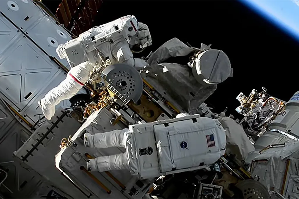 Astronauts working on space station