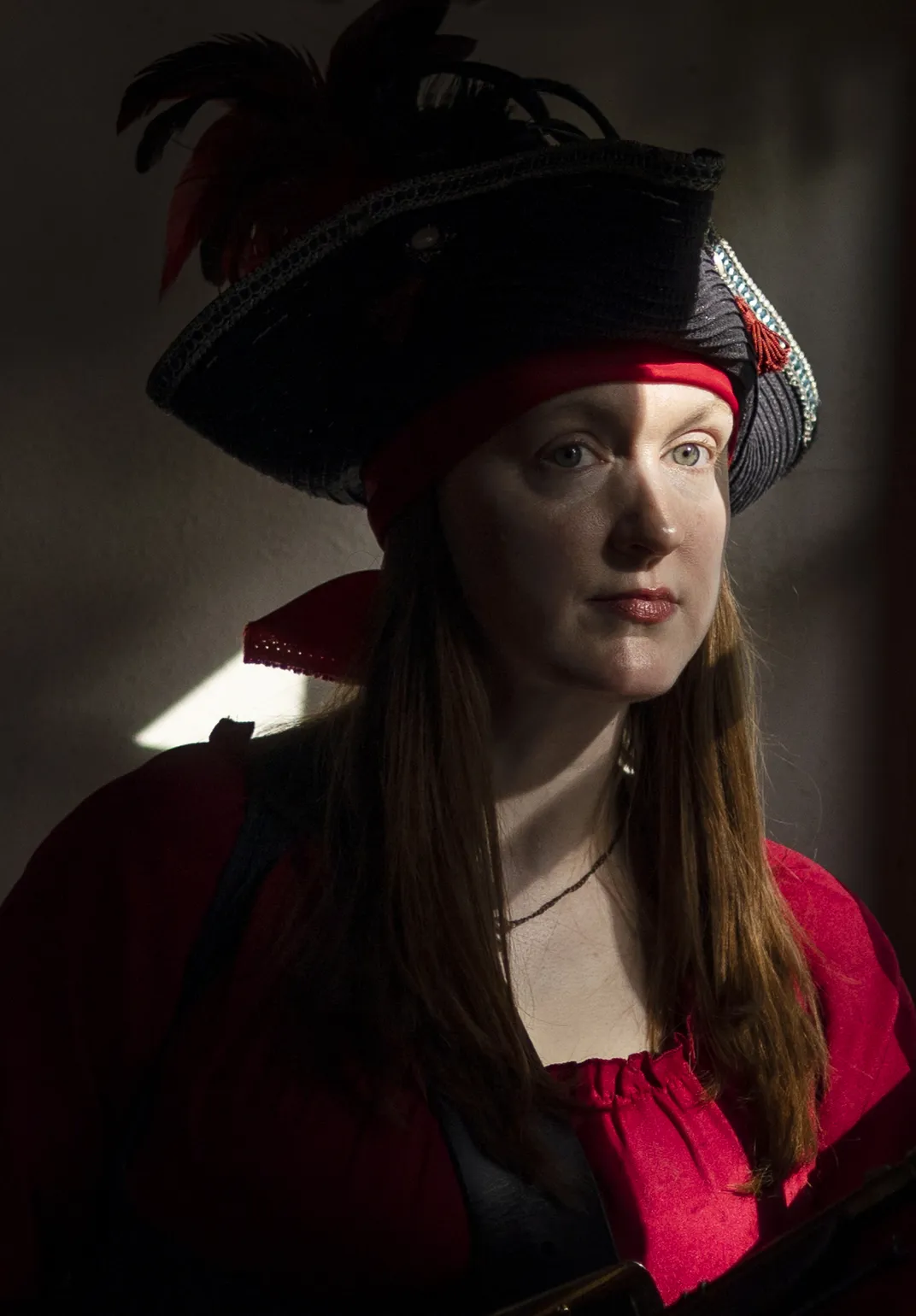 Caroline Drwiega, a historical re-enactor, performs as pirate Anne Bonny at the Pirates’ House in Savannah, Georgia.