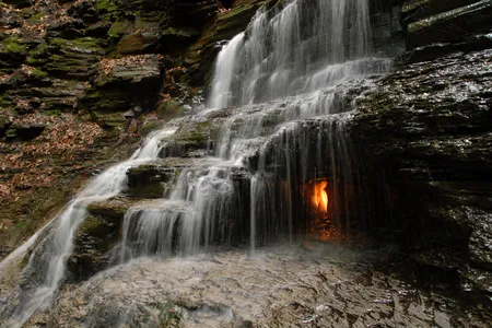 This small, bucolic waterfall in Western New York has one highly photogenic feature: a grotto lit by a dancing orange flame.
