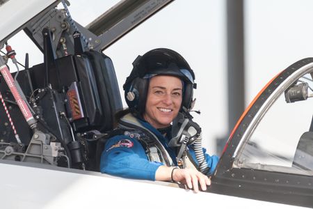 Nicole Mann poses for a portrait in a T-38 trainer jet at Ellington Field in Houston, Texas, in 2018.