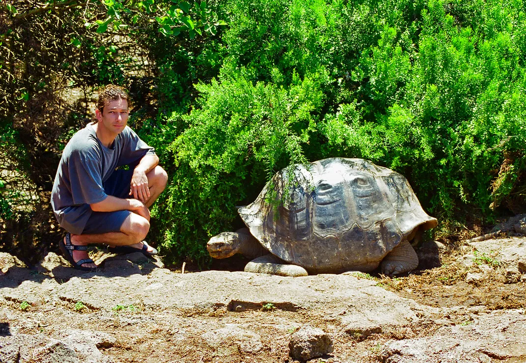 A giant tortoise and a traveler