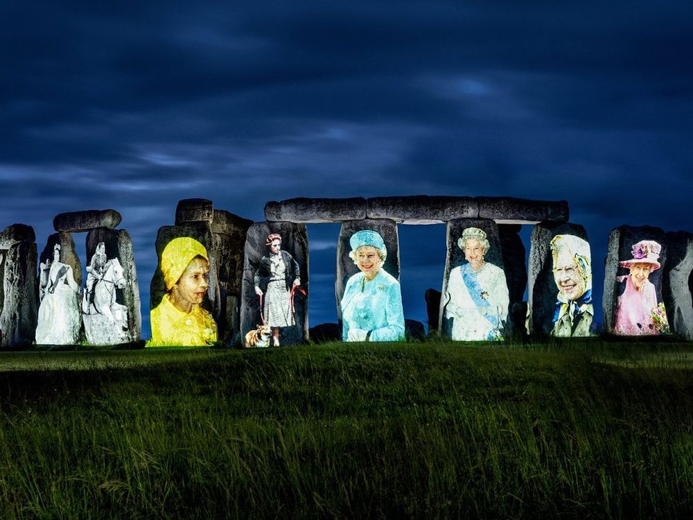 Stonehenge with images of Elizabeth II projected on it