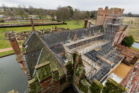 Oxburgh Hall, a moated Tudor manor house in Norfolk, England, is currently undergoing a major renovation project to fix its roof. 