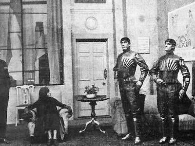A photograph from a staged production of "R.U.R." ("Rossum's Universal Robots").