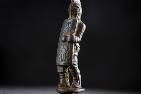 This tiny Roman gladiator figurine used to be the handle on a folding knife.