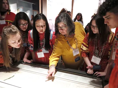 Members of the Cherokee Youth National Choir taking part in the installation of the Treaty of New Echota at the National Museum of the American Indian in Washington, D.C. (Paul Morigi/AP Images for the Smithsonian)