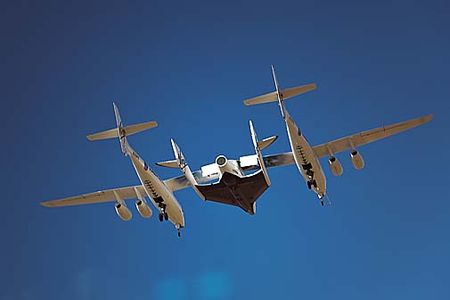 The first "captive carry" and flight of VSS Enterprise or SpaceShip II over Mojave, California Monday March 22,2010. The center mounted spaceship is attached to the "mothership" WhiteKnight II for a series of flight tests prior to its first drop test later in the year.
