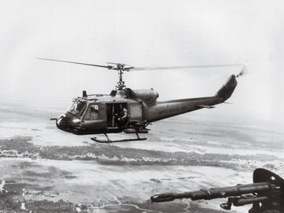Two Bell UH-1Bs, flown by the Navy’s lone helicopter attack unit in Vietnam, patrol the country’s south on a 1967 mission to support Navy SEALs.
