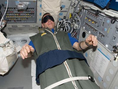 Greg Johnson, asleep during the STS-125 mission.
