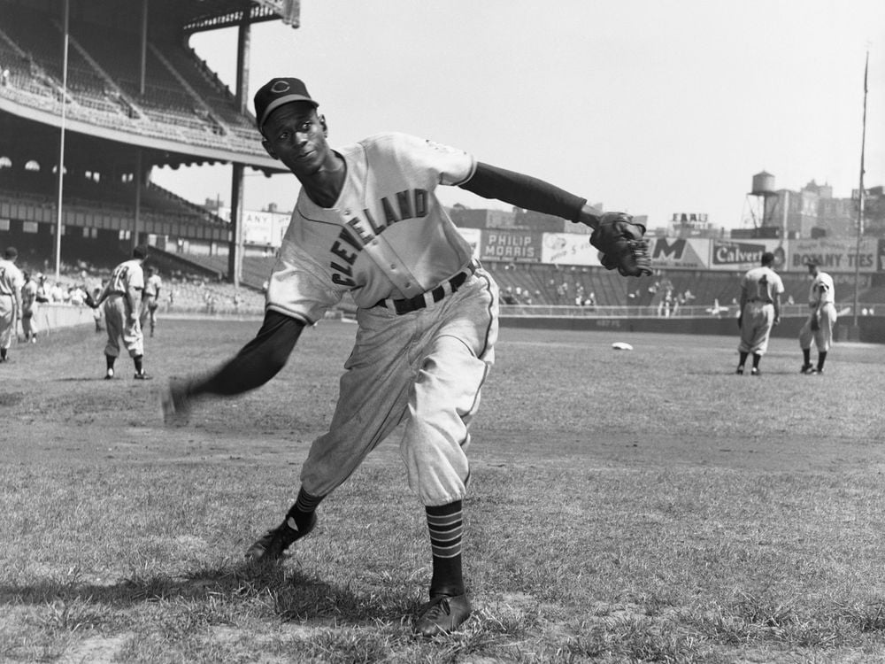 Satchel Paige pitches during warmups