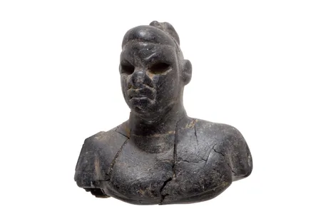 This ebony figurine was found in a child's grave.