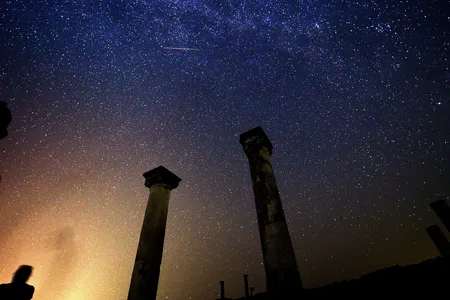 A Perseid streaks across the sky over the archaeological site Stobi in modern-day Macedonia
