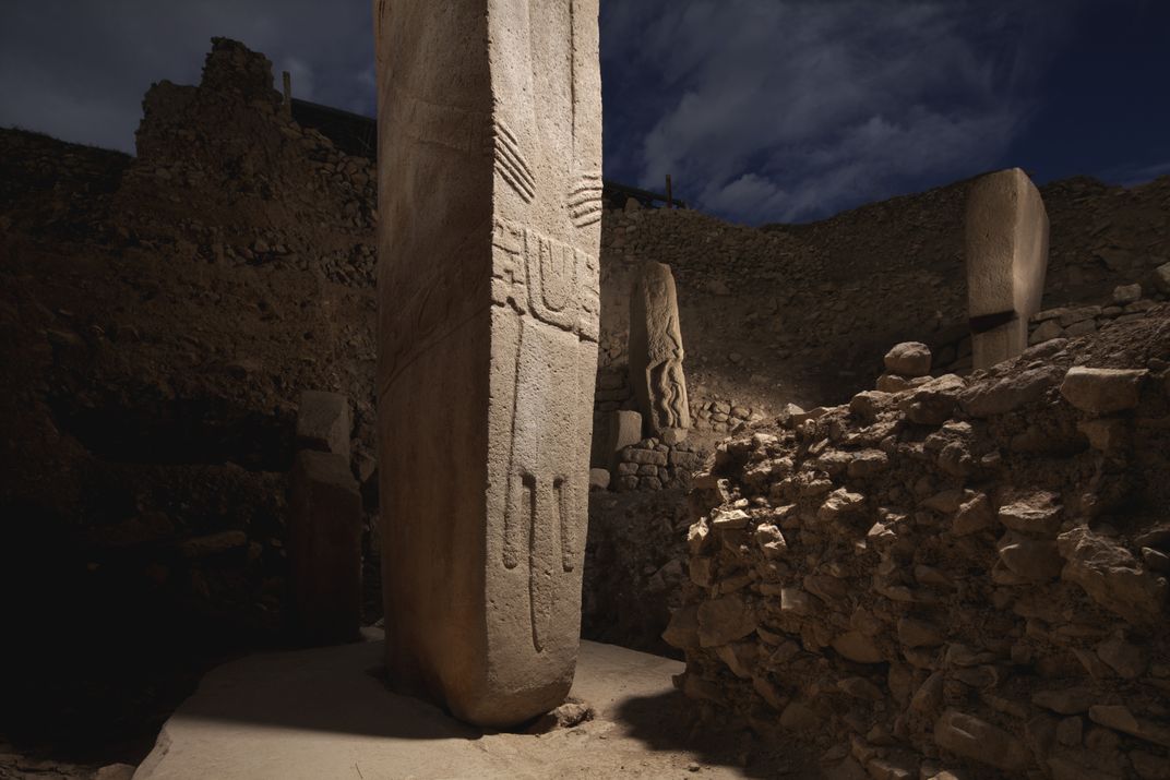 'a stone pillars in a stone building'