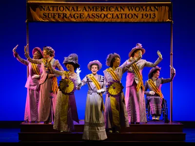 Jenn Colella as Carrie Chapman Catt (center) in&nbsp;Suffs, a new Broadway musical about the women&#39;s suffrage movement
