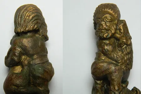 The key handle depicts a "barbarian" fending off a lion as four young onlookers watch in horror.