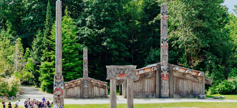  Totem poles and ceremonial house outside the Museum of Anthropology, Vancouver. Credit: Museum of Anthropology