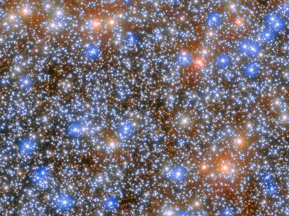 A dense cluster of blue, red and orange stars