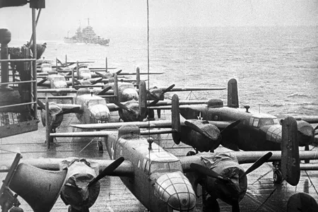 The flight deck of the U.S. aircraft carrier Hornet, some 800 miles off Tokyo Japan, where it shows some of 16 Billy Mitchell (B-25) Bombers, under the command of Major Jimmy Doolittle, just before they were guided off flight deck for historic raid on Tokyo, April of 1942.