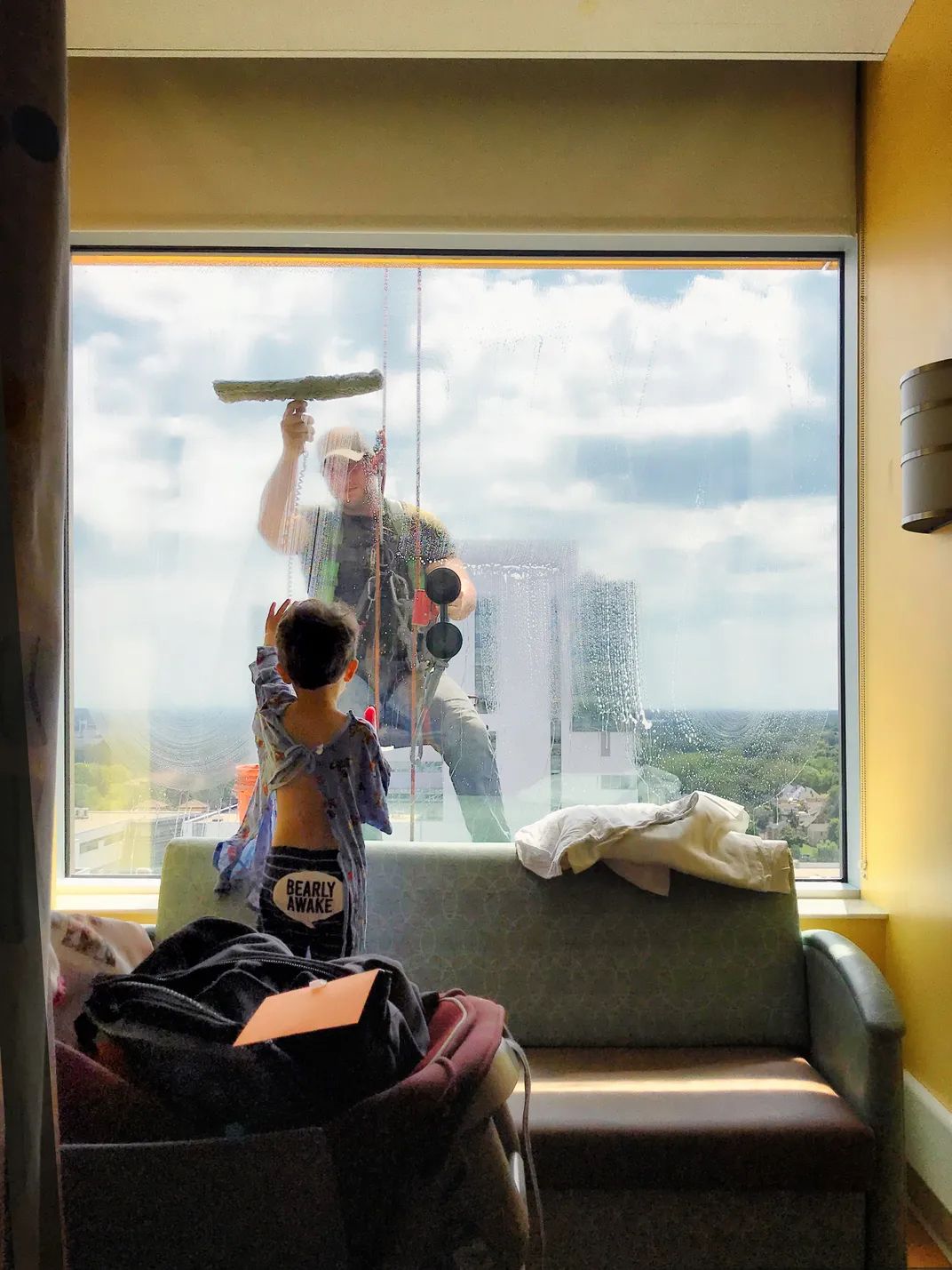 8 - They say you don’t need a cape to be a hero. Sometimes a squeegee and a baseball cap will do, as this window washer found out. He brightened the day of a young hospital patient just by hanging out at work.