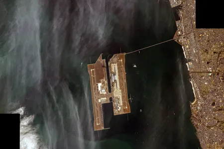 In a 2015 photograph taken from the International Space Station, Kansai International Airport’s artificial islands and 1.86-mile bridge stand out in Japan’s Osaka Bay.
