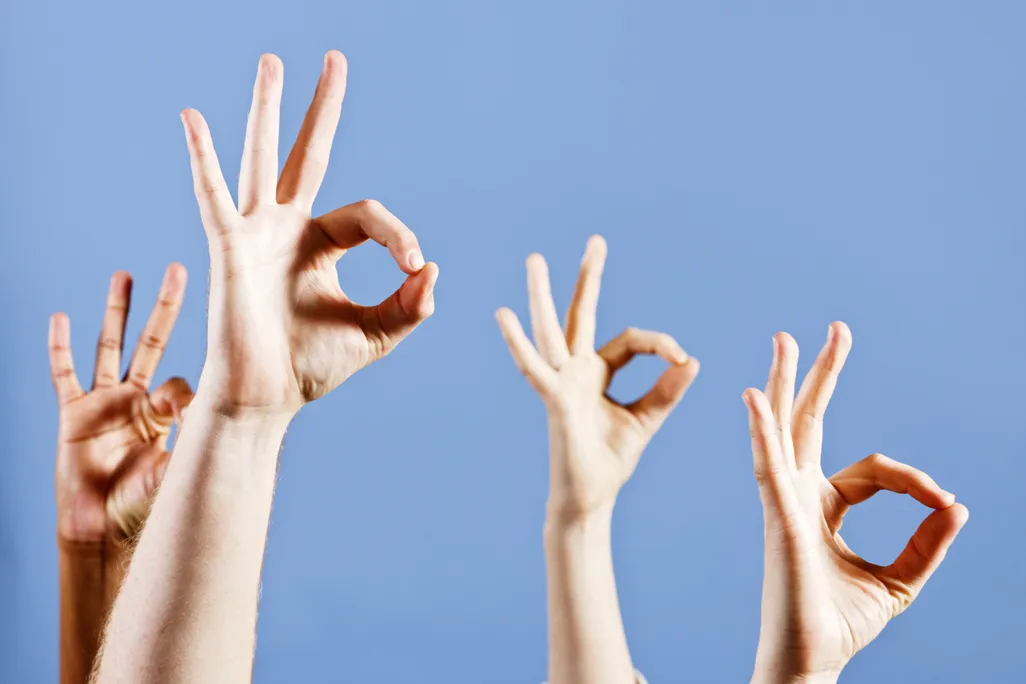 Hands signaling OK