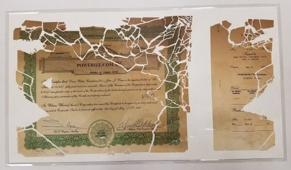 The stock certificate pieced back together and encased in mylar (NMAH)