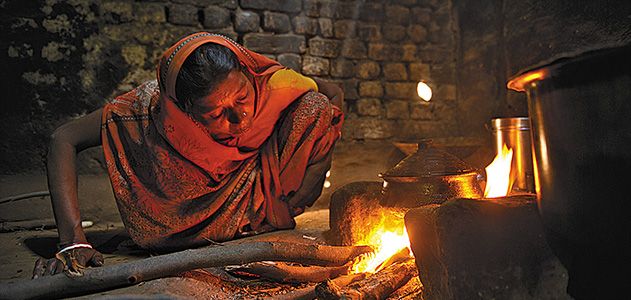 Woman and open fire stove