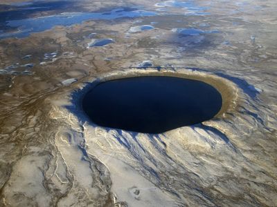 Pingualuit crater’s circular shape, obvious in a 2007 aerial photograph, has made the lake a navigational landmark. With its immense volume, it is slow to freeze and thaw.
