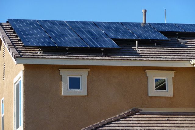 A house in Lancaster, California gets a solar power retrofit.