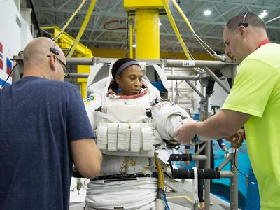 Jeanette Epps tries on a space suit