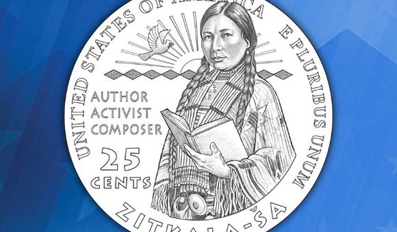 Design of the quarter with Zitkala-Ša from the waist up holding a book. The words “author, activist, composer” are beside her.