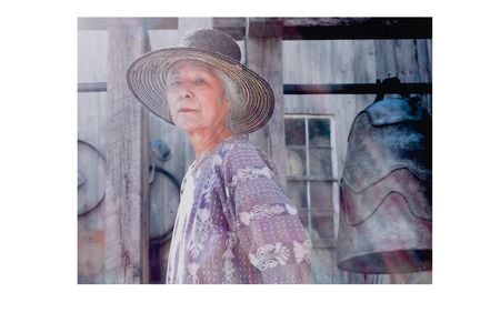 Photograph of Toshiko Takaezu posing with work (detail), September 2004. Toshiko Takaezu papers, 1937-2010. Archives of American Art, Smithsonian Institution.