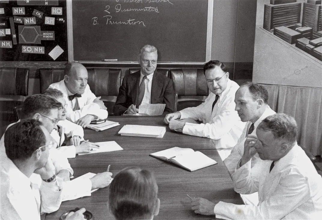 Cornelius “Dusty” Rhoads, center, former medical chief of the Chemical Warfare Service and director of the Sloan Kettering Institute for Cancer Research.