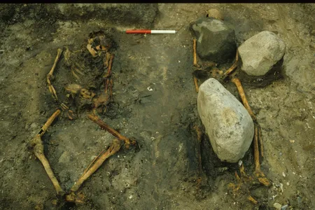 The male skeleton's neck and legs were arranged in an unnatural position, while the woman's remains were held in place by large stones.