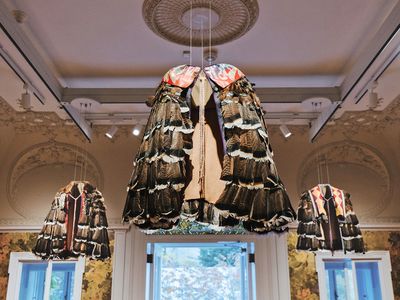 Welcome to Territory, by the Lenape Center with Joe Baker, features turkey-feather capes suspended from the ceiling