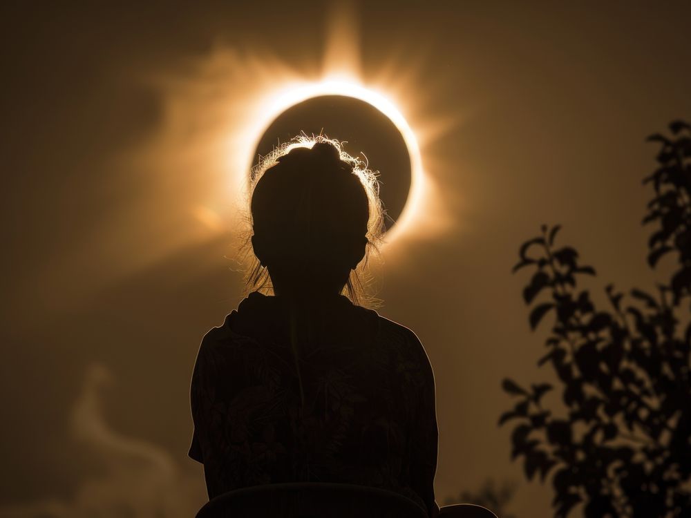 Astronomy_solar eclipse with person silhouette_ss_2446301659.jpg