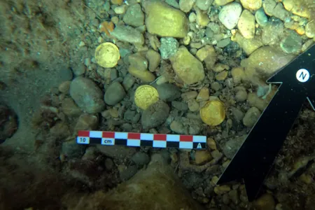 Two men found the coins while diving in Portitxol Bay along the Mediterranean coast.