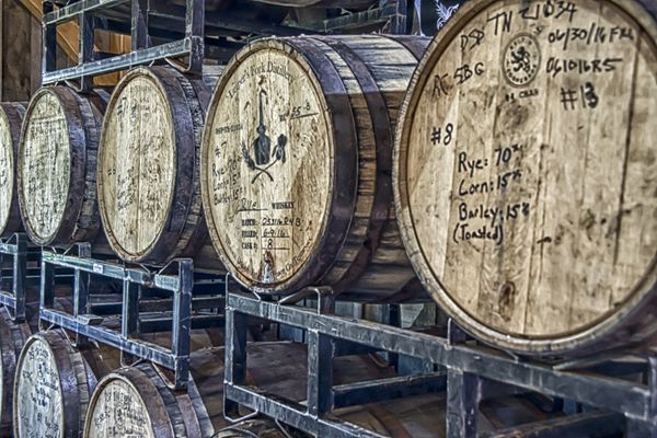 Whiskey barrels in distillery thumbnail