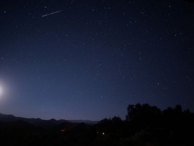 A Delta Aquarid meteor streaks across the sky.