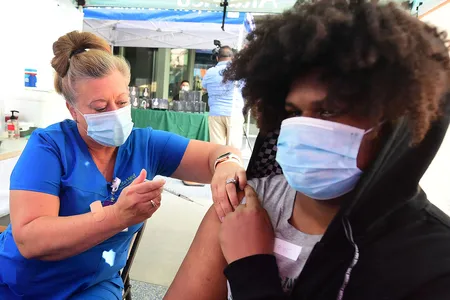 A nurse administers the Pfizer Covid-19 vaccine in Los Angeles, California, in August. More than one million individuals have gotten a third dose of the Pfizer or Moderna vaccine in the United States.